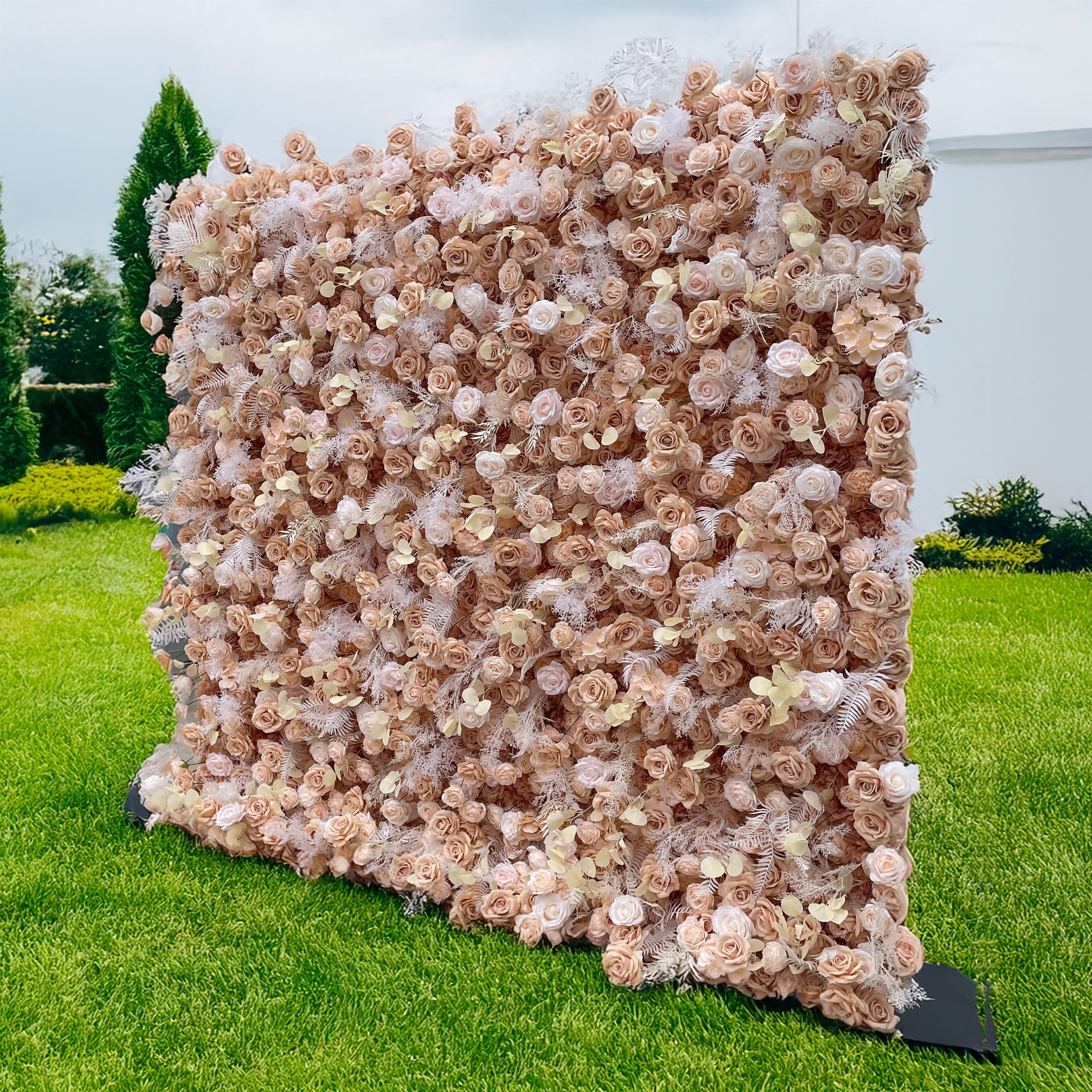 A side view of the ValarFlowers nude floral wall, showcasing lush blush roses, champagne blooms, and frosted fern accents. Ideal for weddings or events, it adds a touch of elegance to any celebration.