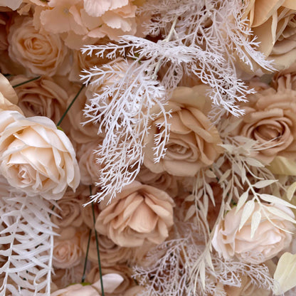 This close-up of a ValarFlowers floral wall showcases a refined blend of blush roses, soft beige petals, and intricate white foliage, creating an elegant and luxurious texture perfect for upscale events.