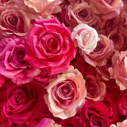 This image features a dense arrangement of artificial roses in a rich palette of colors. Predominant hues range from deep magenta to soft pastel pinks and peaches. The roses vary in size and petal arrangement, creating a lush and textured appearance. The overall style is romantic and vibrant, making it perfect for event decorations, such as weddings or photo - backdrops. 