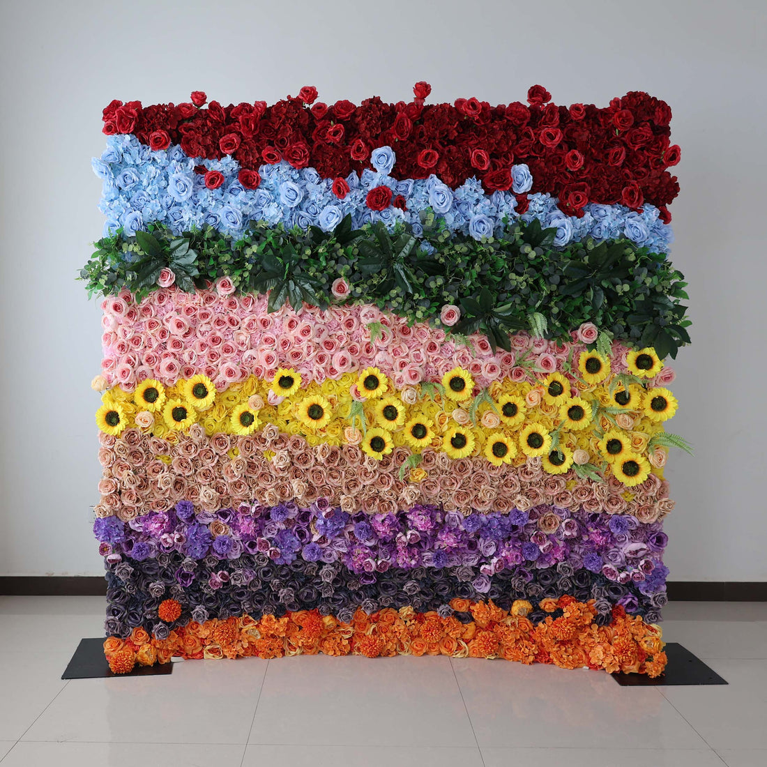 A vibrant floral wall by ValarFlowers, featuring an array of colorful artificial flowers. Ideal for event backdrops, photo - ops, and venue decor.