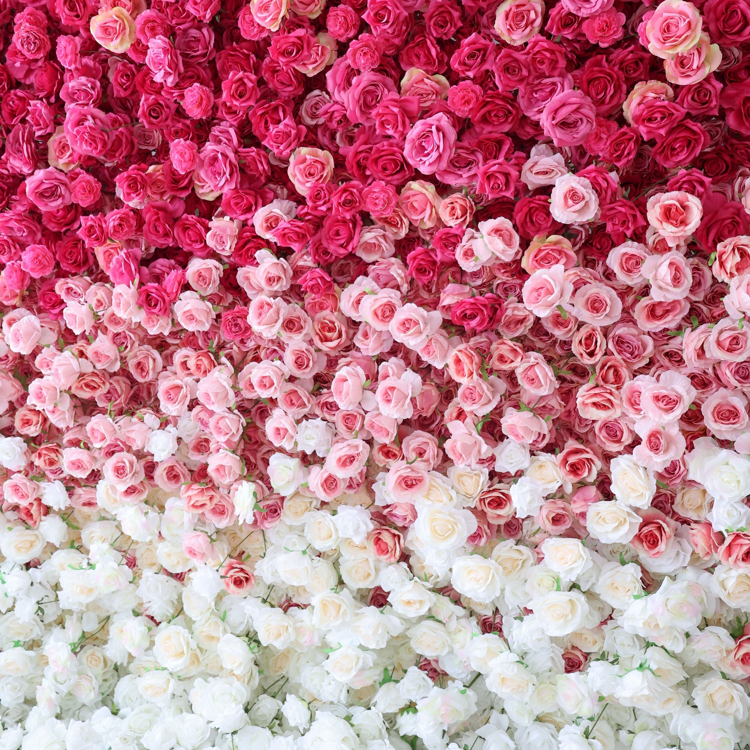 This artificial flower wall features a stunning gradient of pink to white roses. It is likely easy to install, durable, and suitable for various events such as weddings and parties. The flowers are densely packed, creating a lush and romantic appearance.