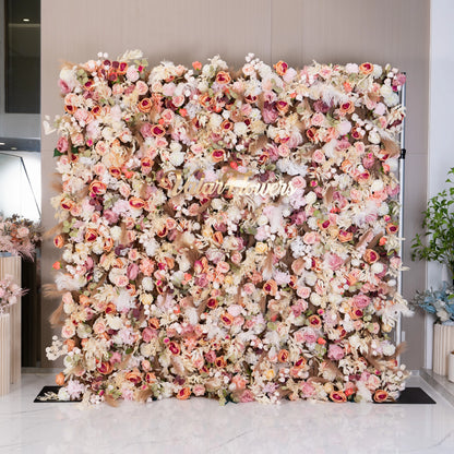 This floral wall features an opulent mix of blush, cream, and soft pink roses with pampas grass. Perfect for elegant events, it creates a warm and inviting atmosphere with its rich textures and romantic hues, enhancing any sophisticated backdrop.