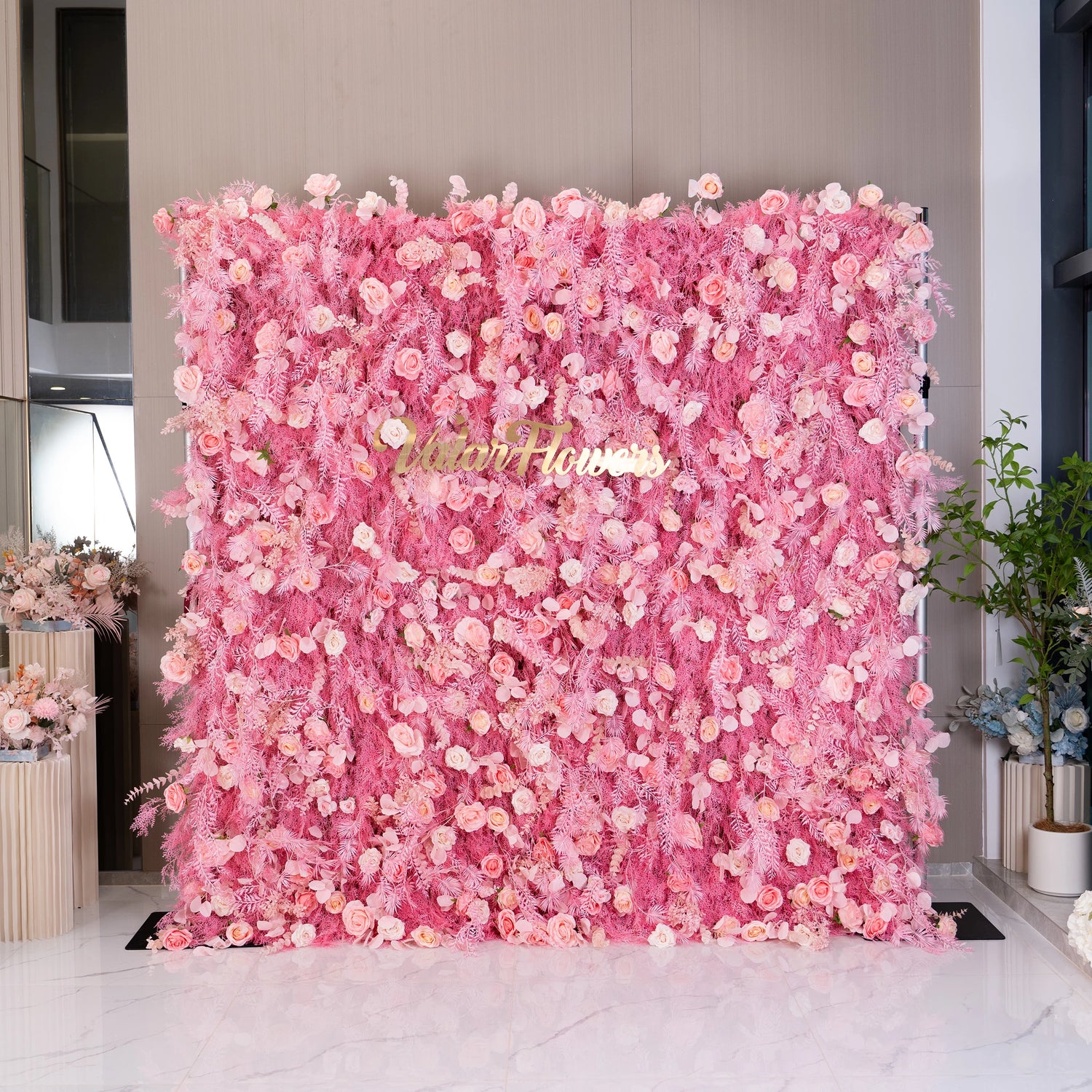 This floral wall is a vibrant cascade of pink blooms and delicate roses. Perfect for weddings and events, it brings a lively, romantic atmosphere with its lush textures and soft hues, enhancing the elegance of any setting.