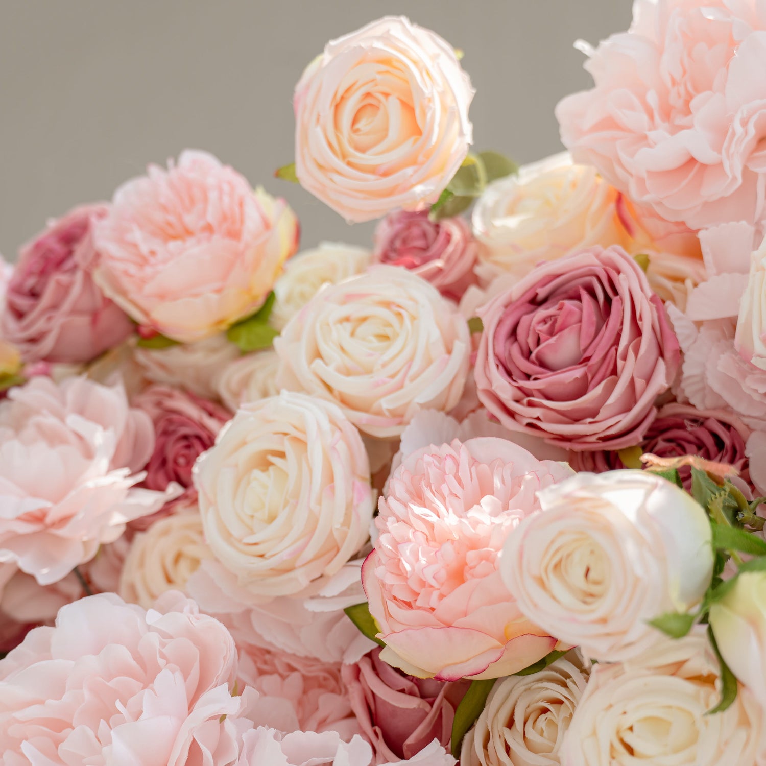 The image showcases a detailed arrangement of artificial flowers. Each petal&