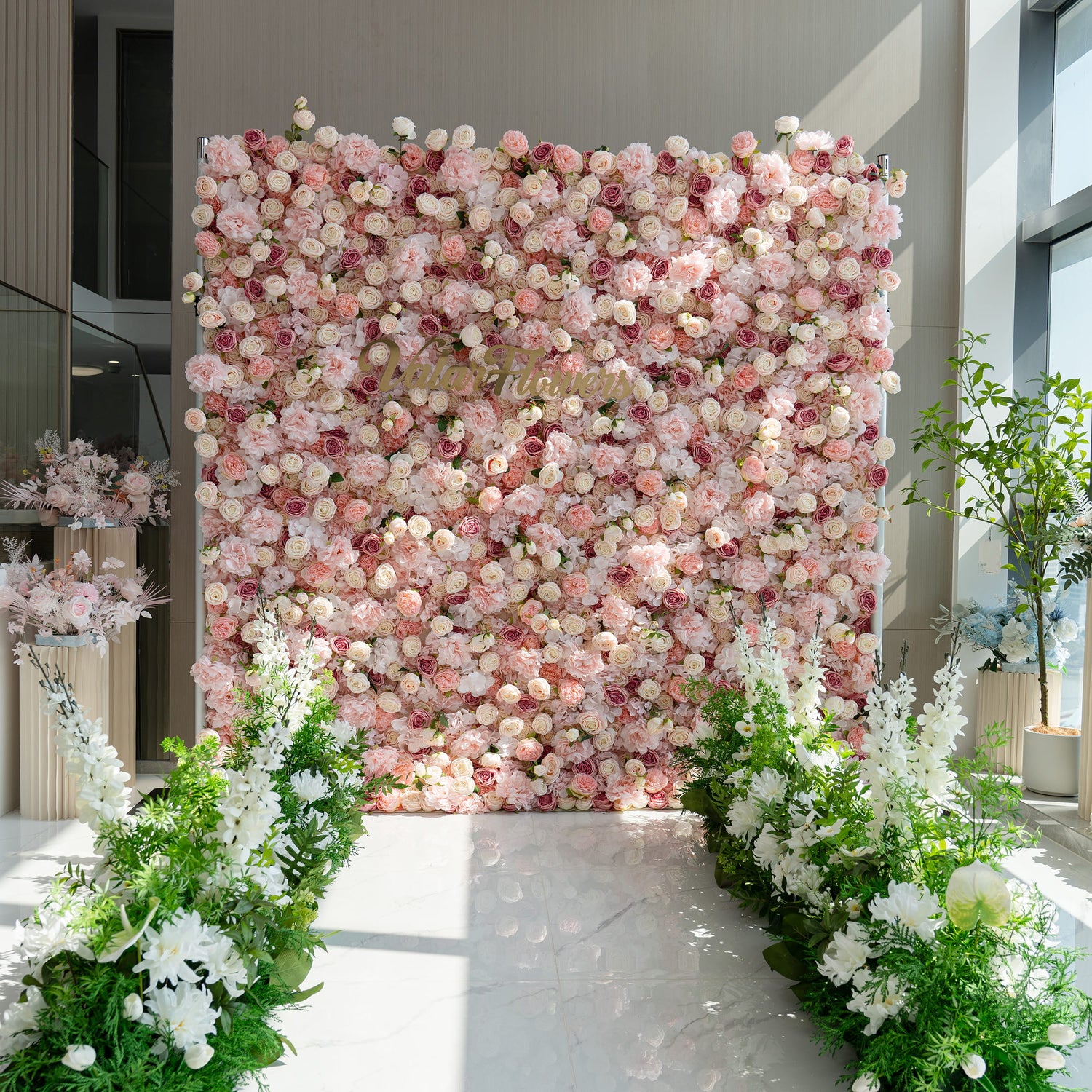 The floral arrangement features a lush, pink - toned flower wall with the text &quot;Valar Flowers&quot; prominently displayed. The white flower aisle guides are perfect for weddings, creating a romantic and elegant pathway for the bride to walk down.