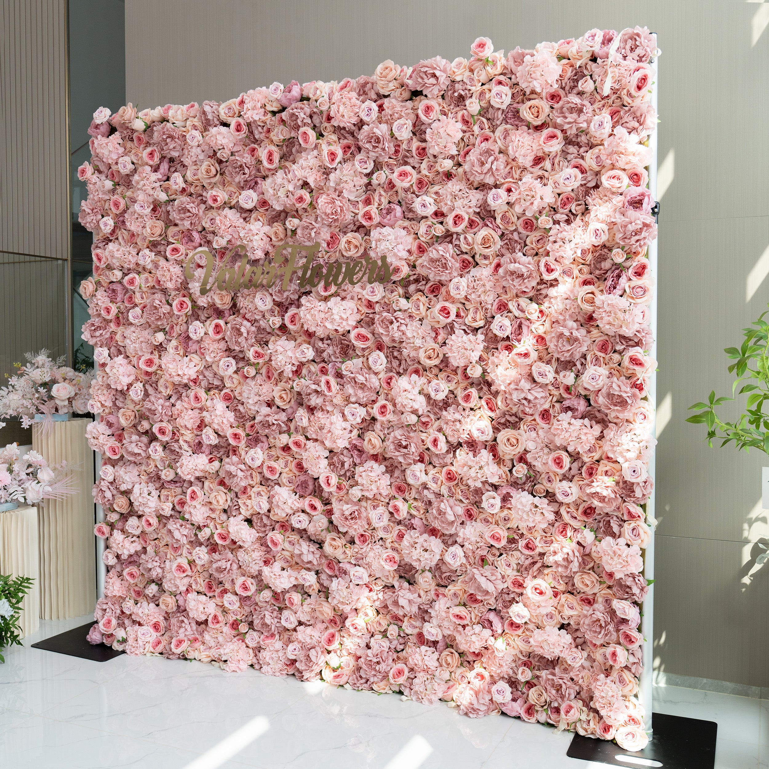 Yes, the floral arrangement can likely be customized. The images show a variety of floral walls with different colors and flower types, indicating that the arrangements can be tailored to specific preferences or themes. Whether it&