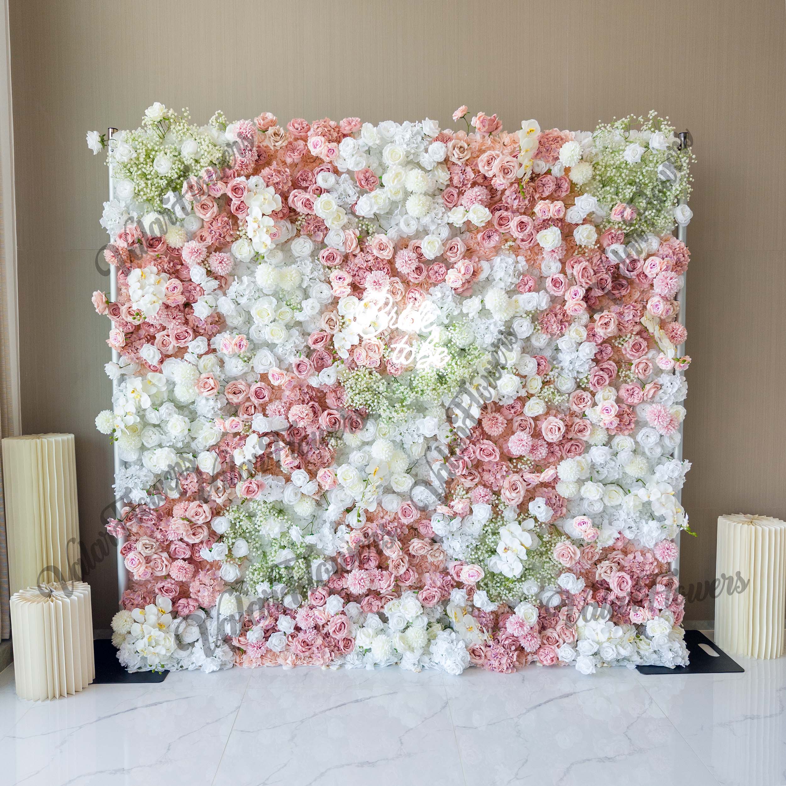 Elegant artificial flower wall backdrop featuring a blend of blush pink and white roses. Perfect for weddings, ceremonies, and events. Realistic, high-quality materials on a sturdy frame. Ideal for photo backdrops and decor. Easy to set up and enhances event ambiance.