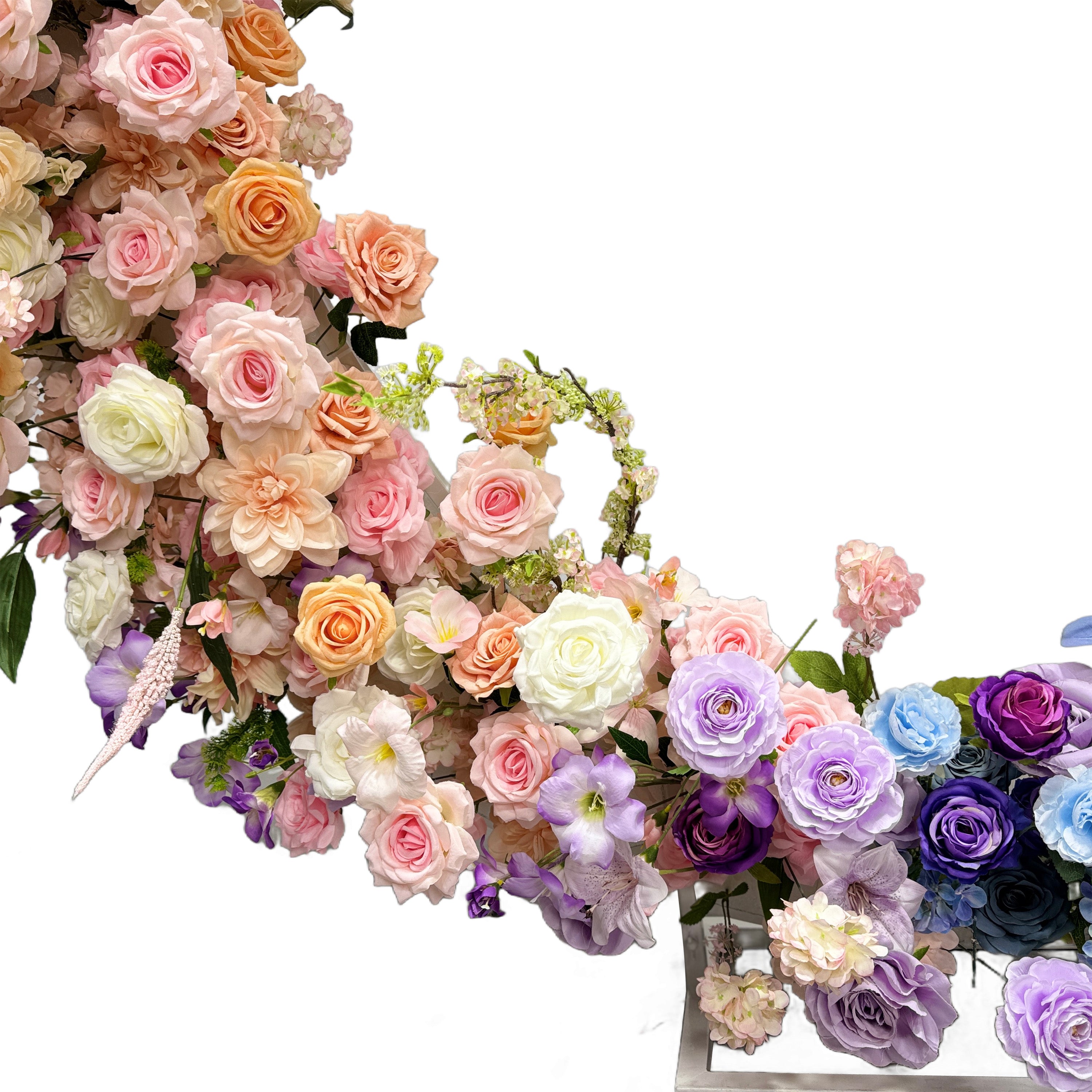 The arch is a stunning floral arrangement featuring a variety of roses in soft pastel shades like pink, peach, and purple, interspersed with green foliage, creating an elegant and romantic look.