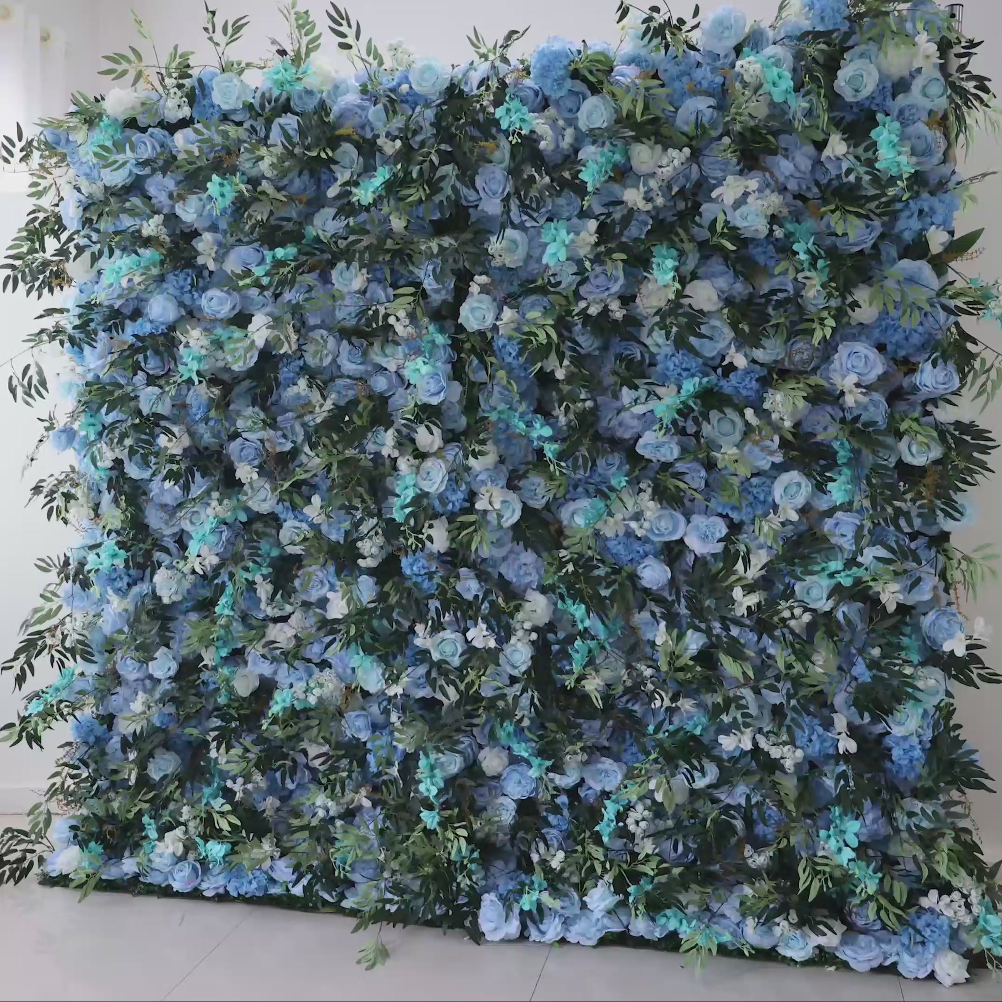 Video of ValarFlowers Artificial Floral Wall Backdrop: Enchanted Bluewood - A Symphony of Deep Blues and Lush Greens.